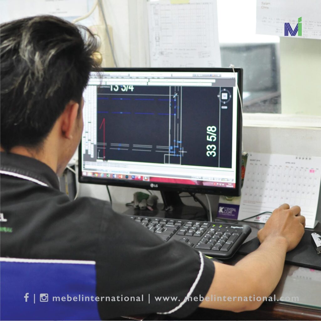 Mebel International furniture manufacturer engineer reviewing furniture CAD drawing on computer