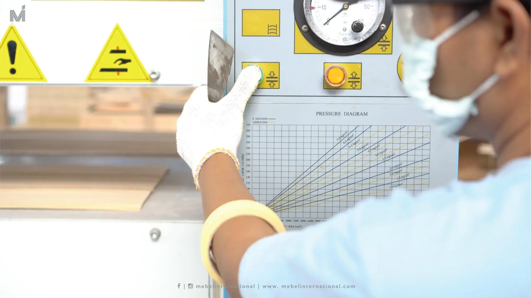 Mebel International furniture manufacturer technician operating wood press machine control panel