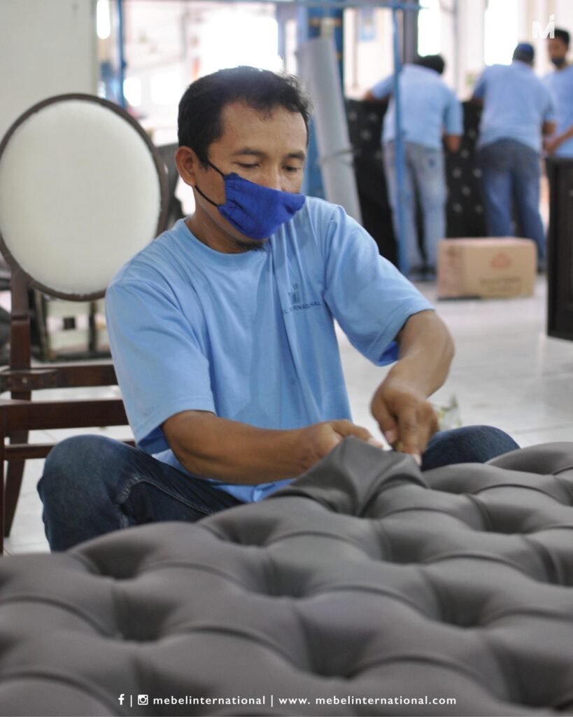 Mebel International furniture manufacturer craftsman tufting upholstered bench in workshop