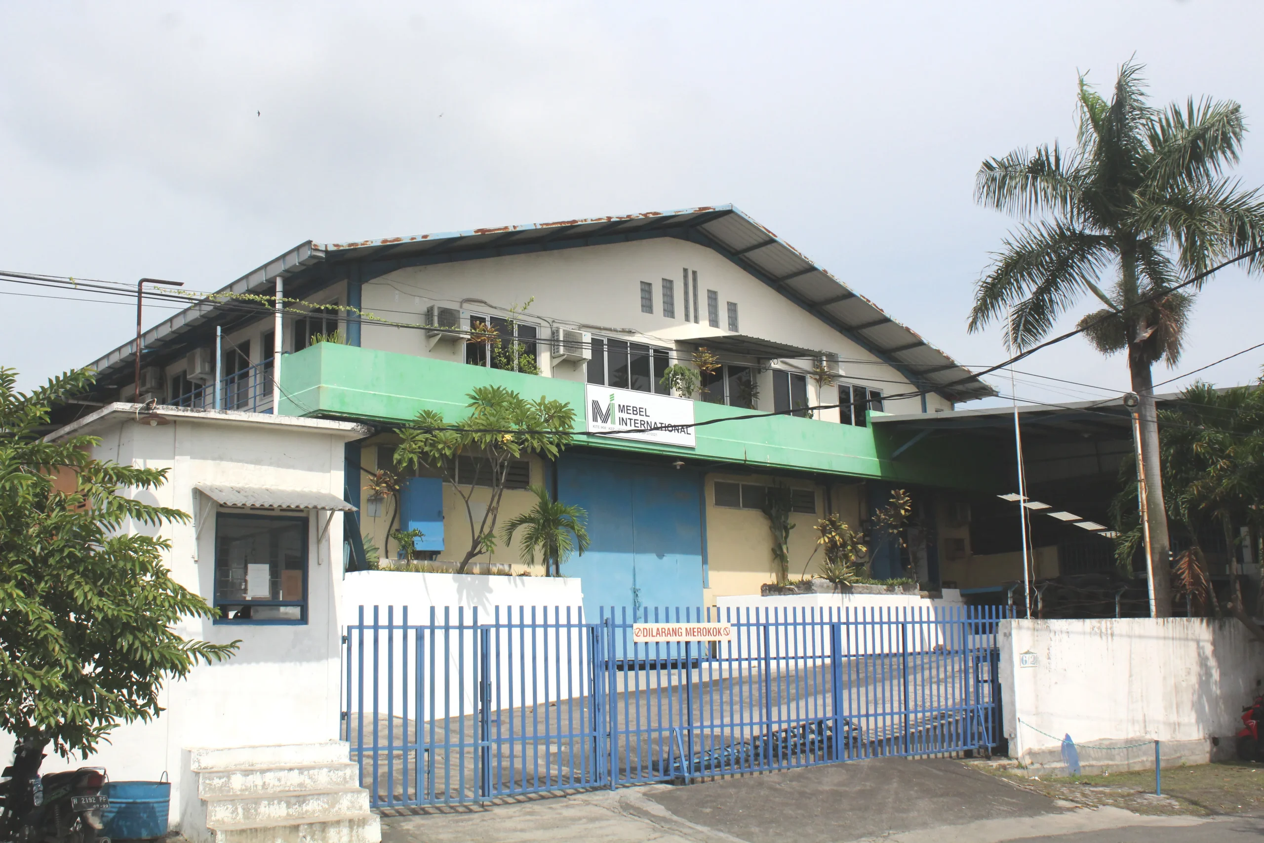 Exterior of Mebel International furniture manufacturer factory building with gated entrance