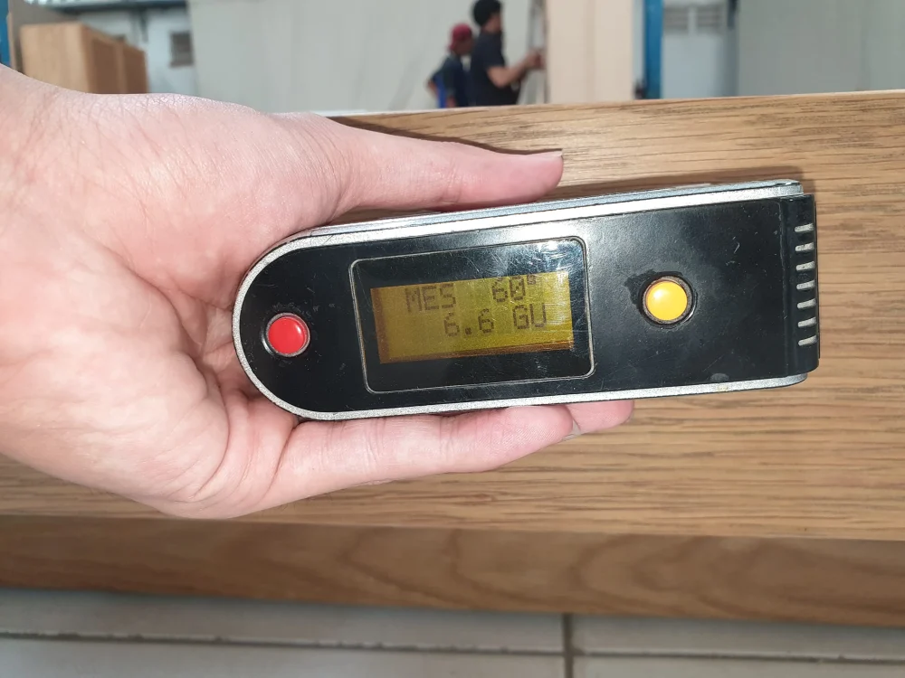 Mebel International furniture manufacturer measuring wood moisture using digital tester