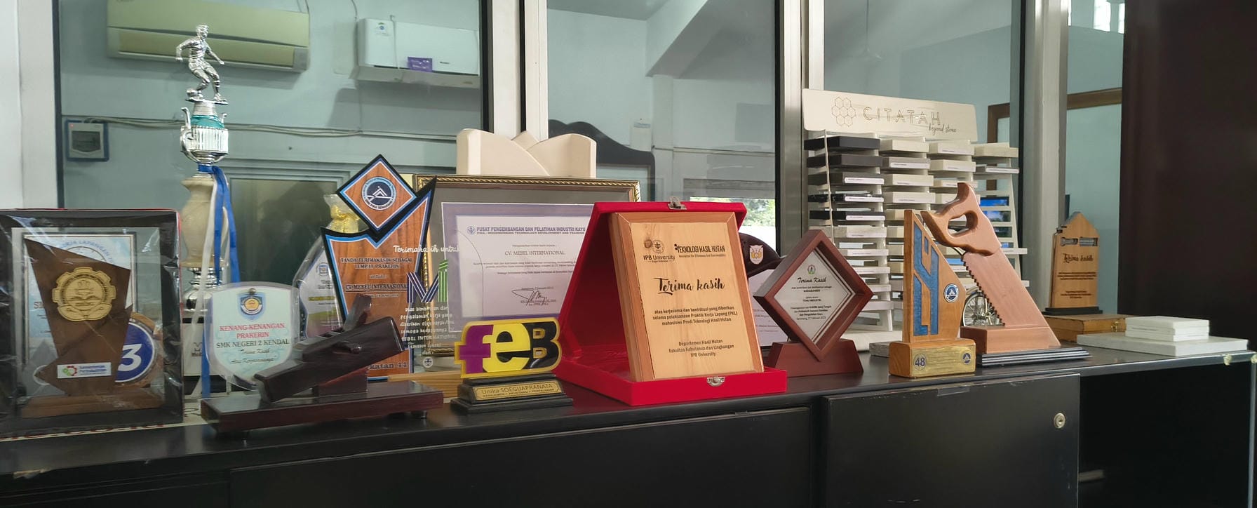 Awards display at Mebel International furniture manufacturer office